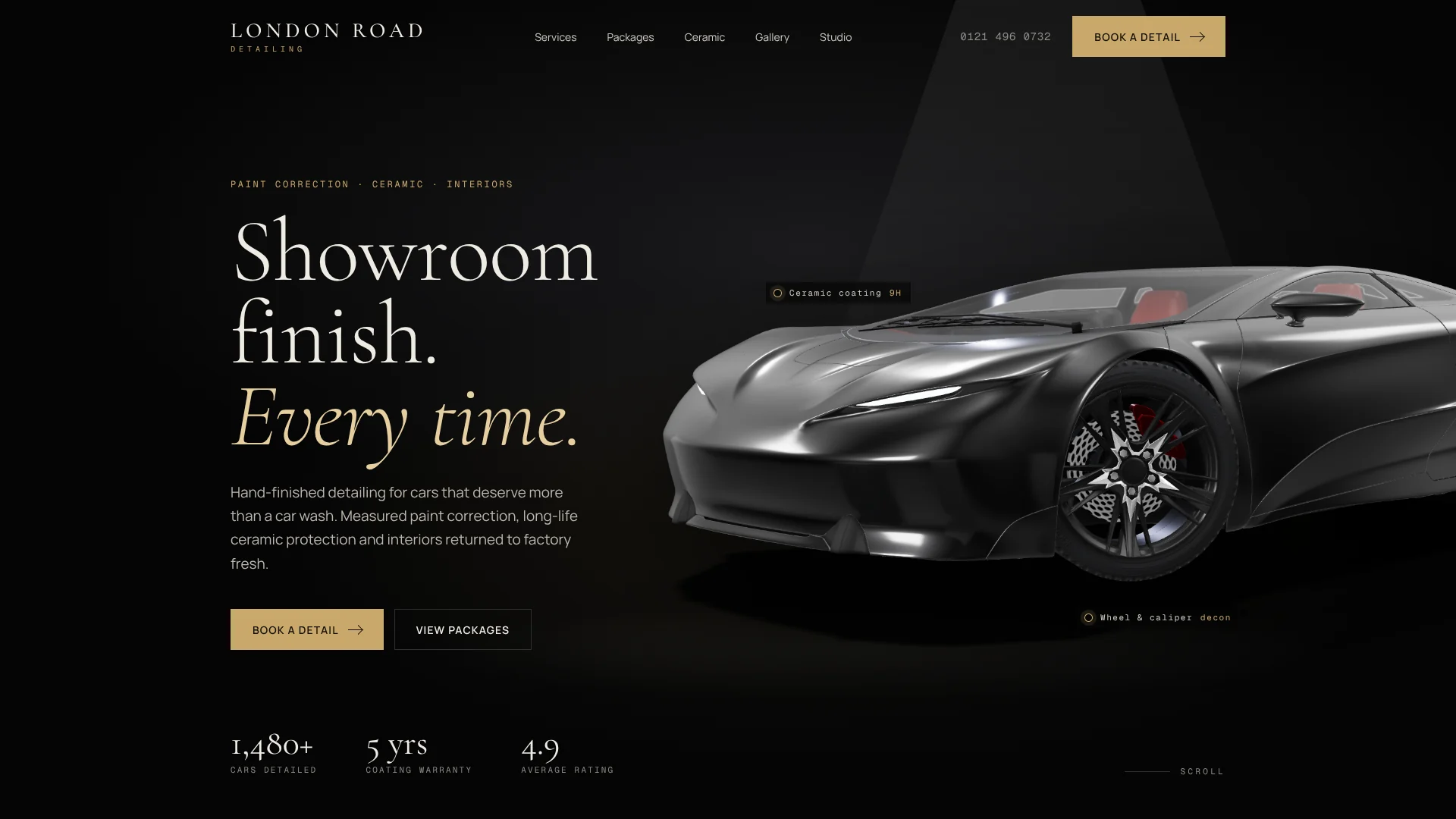 London Road Detailing homepage with a gloss black coupé under a studio spotlight and the headline "Showroom finish. Every time."
