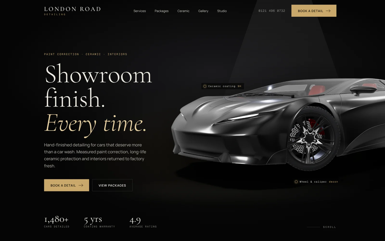 London Road Detailing homepage with a gloss black coupé under a studio spotlight and the headline "Showroom finish. Every time."
